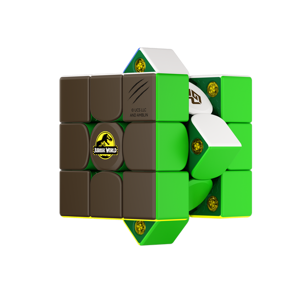 Jurassic World magnetic cube twisted to show green inner shell and amber magnet capsules